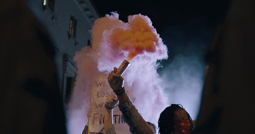 Activists protesting with smoke grenades
