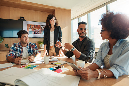 Designers working together on a creative project.
