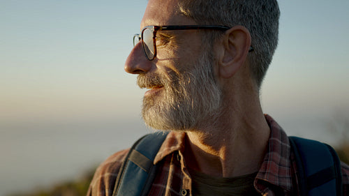 Hiker enjoying a view during trekking trip
