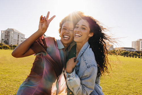 Young girls having fun outdoors, enjoying city lifestyle and bonding