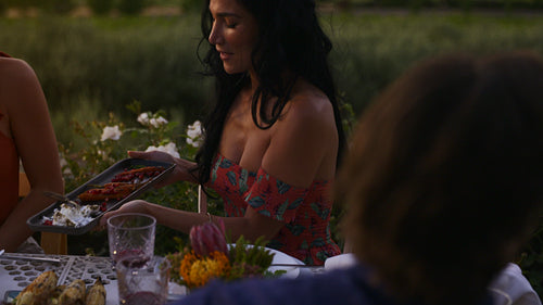 Friends having a great time at dinner party