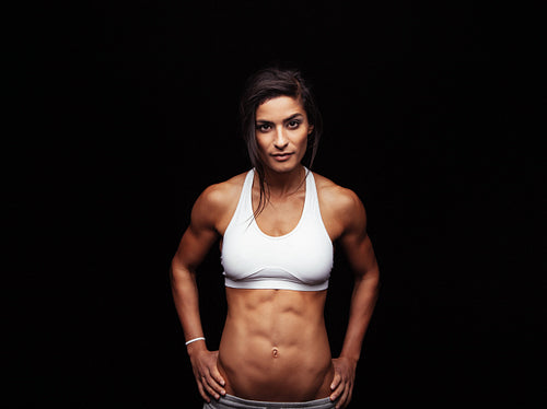 Confident fitness woman wearing sport bra