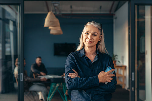 Smiling senior business woman at office