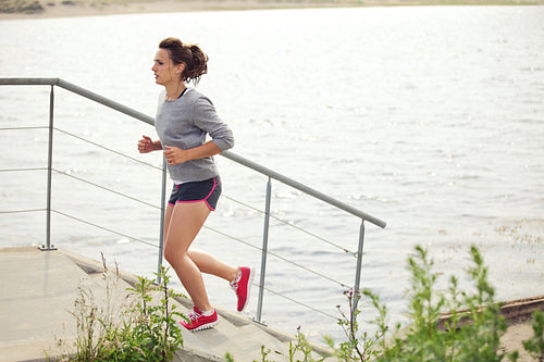 Young Female Athlete Doing Running as Training