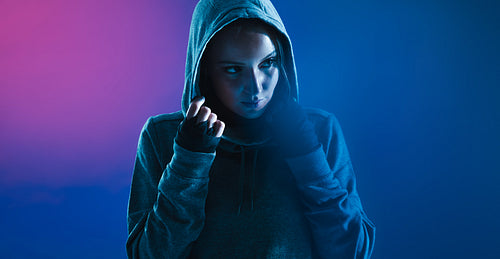 Sporty woman in a hooded shirt