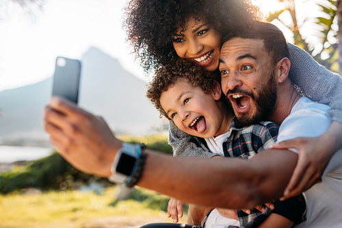 Man taking a selfie with his family