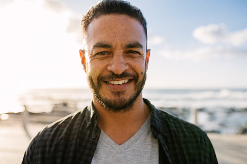 Man on vacation standing near the sea