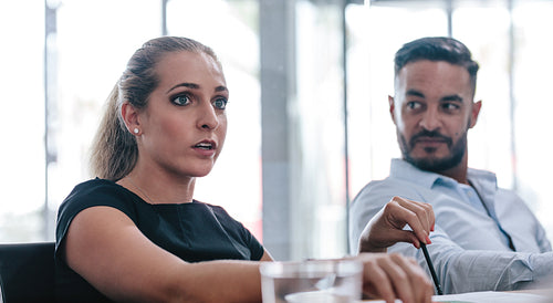 Female executive talking in strategy meeting