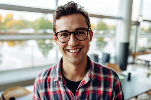 Businessman looking happy in office