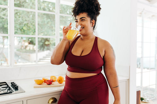 Healthy woman having a glass of juice
