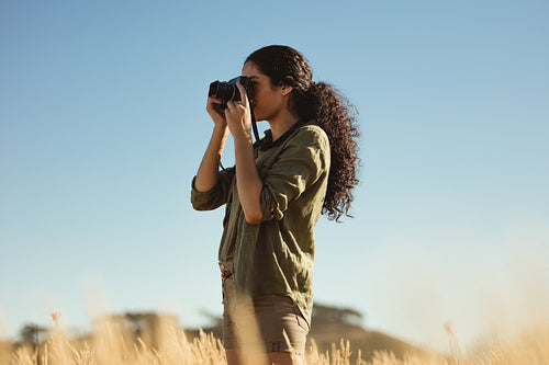 Female taking photos outdoors