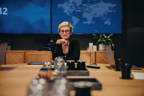 Confident female entrepreneur in meeting room