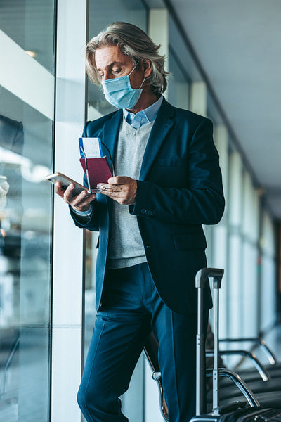 Traveler waiting for his flight at airport