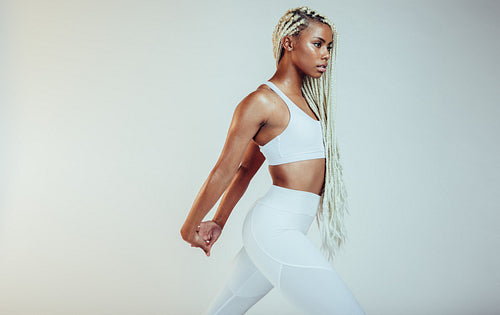 Athletic woman doing stretching exercise