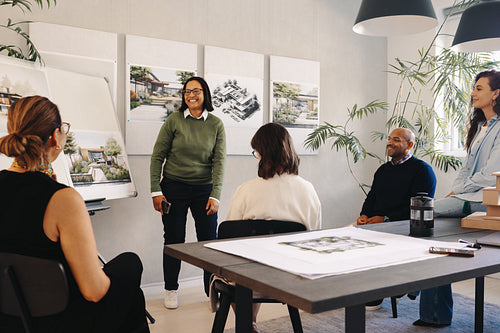 Team discussing project management plans in a modern office setting