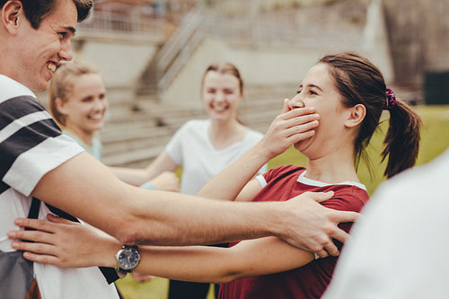 Teenage friends meeting at college campus