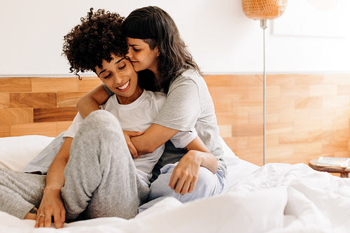 Young lesbian couple being romantic at home