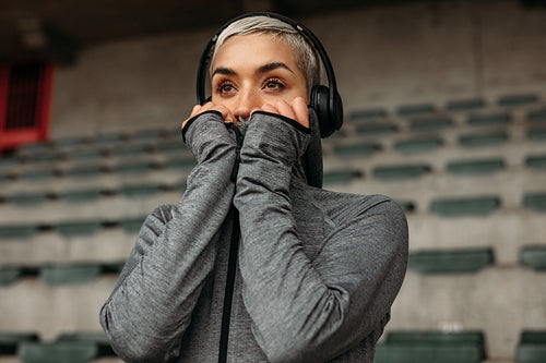 Close up of a woman in the stands of a stadium