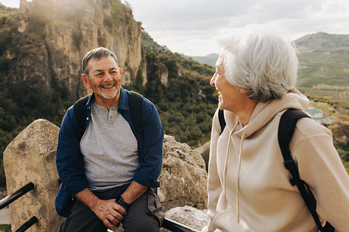 Adventurous senior couple enjoying a leisurely hike outdoors