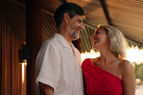 Smiling couple enjoying an elegant evening in a stylish restaurant setting