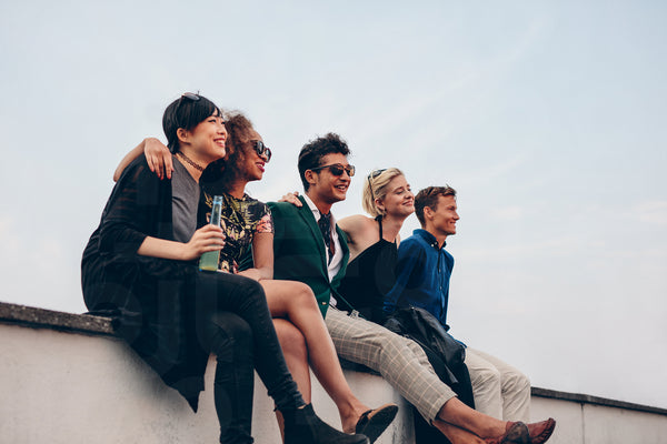 Multiethnic friends relaxing on terrace
