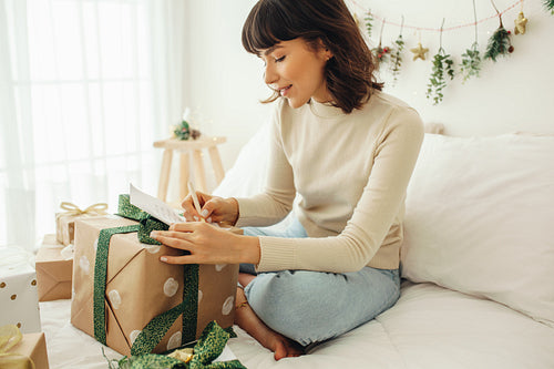 Close up of a woman writing a letter