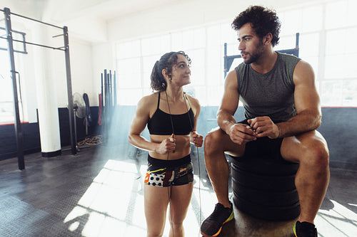 Fitness couple taking a break after physical training