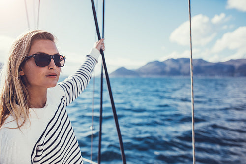 Beautiful young woman on boat trip