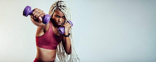 Woman training on punching exercises