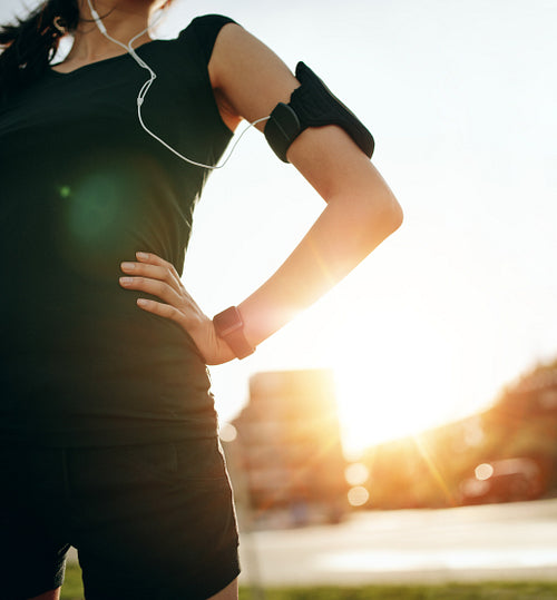 Woman taking a break from running workout