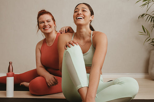 Cheerful women relaxing during a workout session