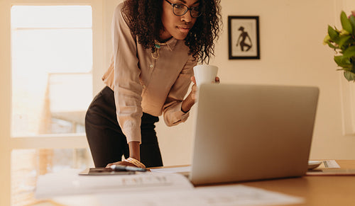 Woman entrepreneur working from home on laptop