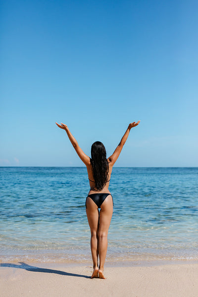 Young woman in bikini on the beach