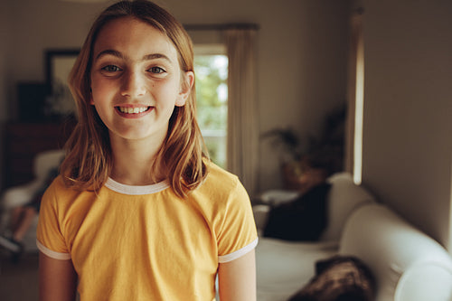 Close up of a smiling girl at home