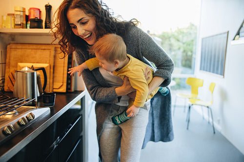 Woman with her baby boy at home