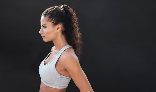 Fit young woman in sports bra
