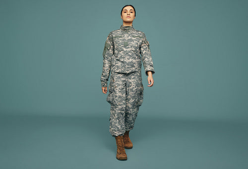 Patriotic army soldier marching in a studio