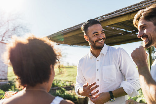 Group of multi-ethnic friends having party outdoors
