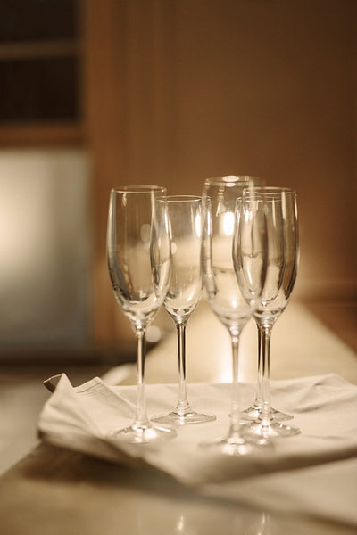 Empty champagne glasses on bar counter