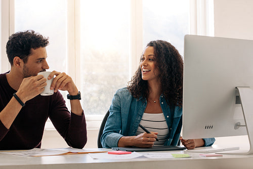 Business partners sitting together and working in office 
