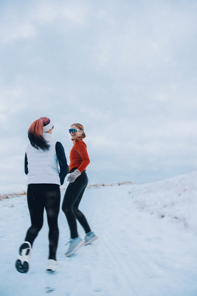 Winter running with women on a snowy trail builds fitness together