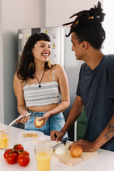 Cheerful couple bonding in the kitchen
