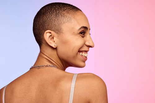 Smiling woman with shaved head