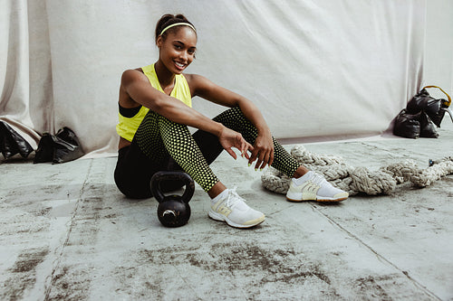 Portrait of a female athlete relaxing after workout