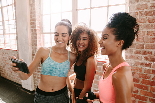 Female friends taking a selfie after fitness training