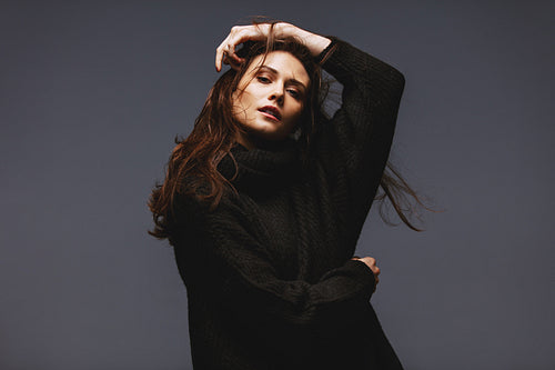 Stunning female model posing in warm clothing