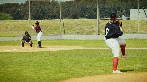 Baseball players execute a hit and run play