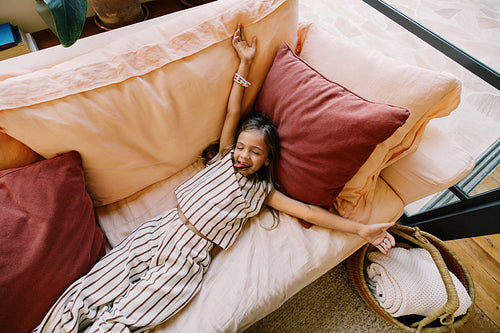 Relaxing at home with girl on couch
