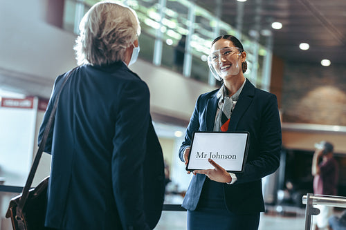 Private driver welcoming traveler at airport