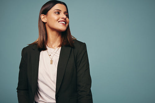 Carefree young woman looking away with a smile